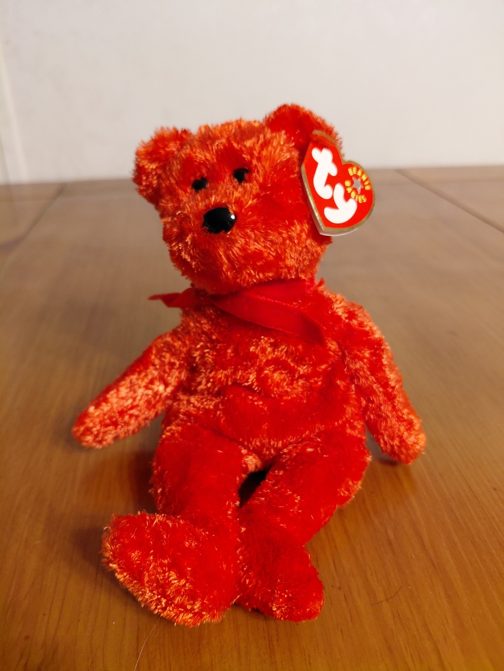 Ty Beanie Baby plush bear named "Sizzle".